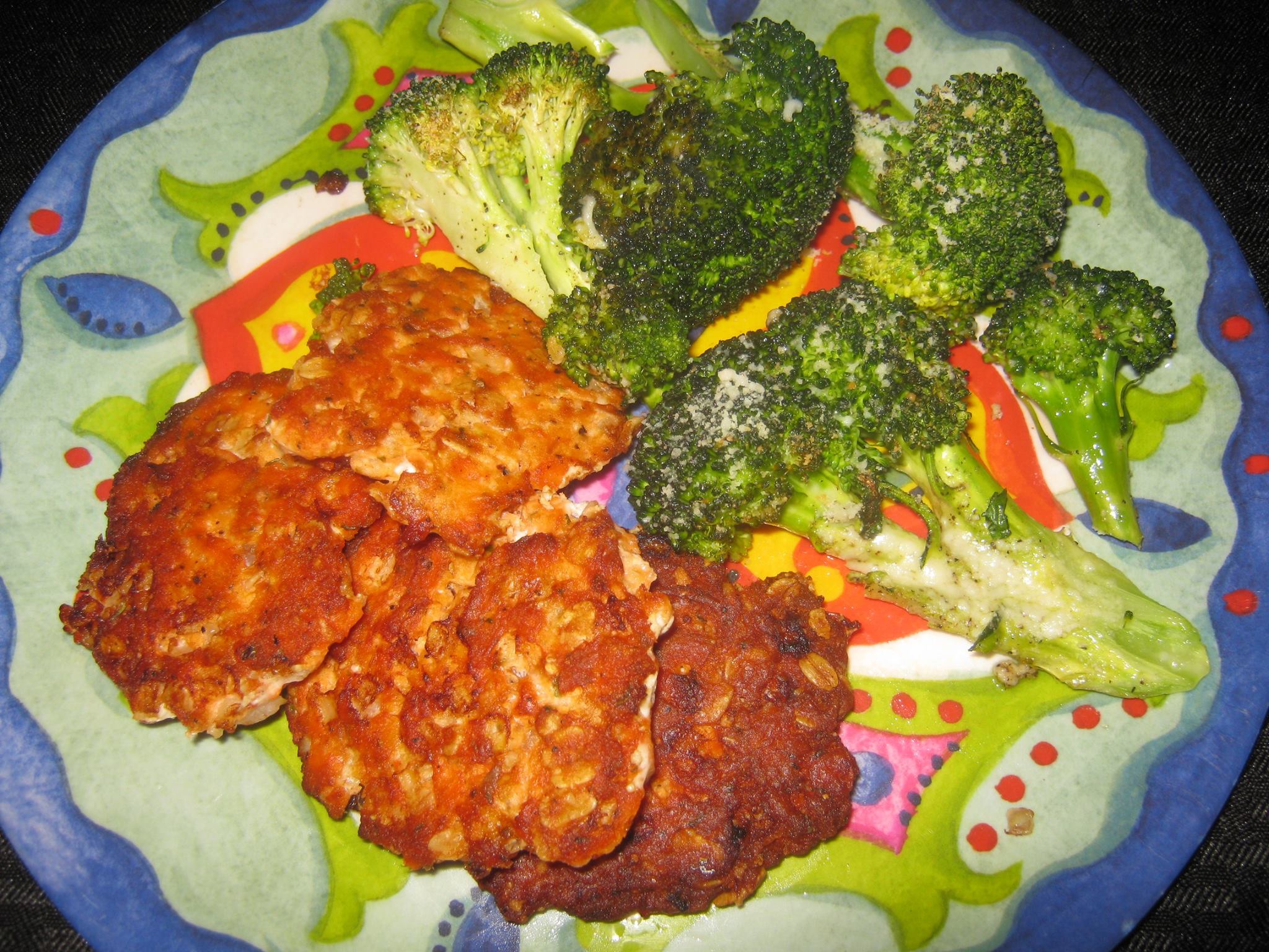 Salmon patties and broccoli parmesan cheese