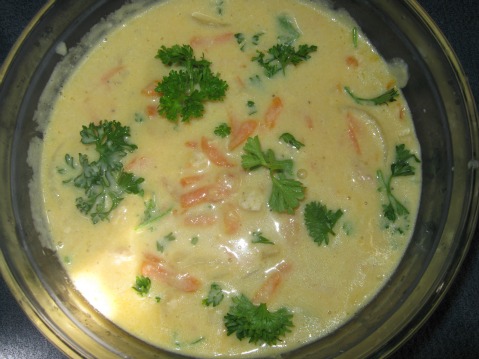 Glass bowl full of cheddar cheese chicken soup