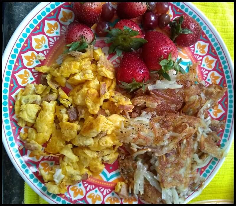 Hash browns strawberries eggs and ham