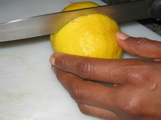 Cutting lemon in half