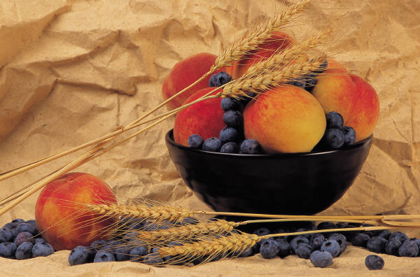 Bowl of nectarines blueberries and wheat