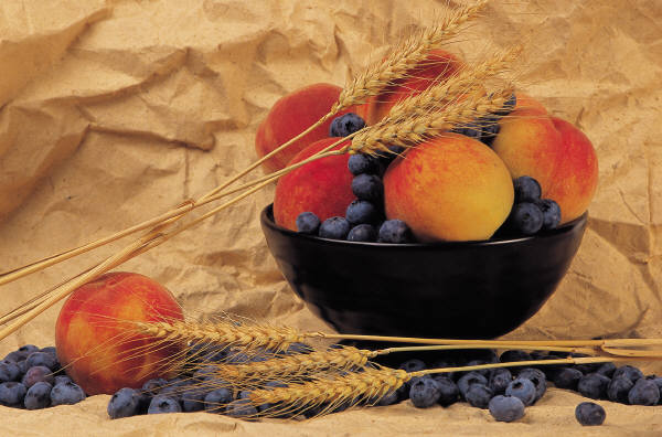 Bowl of nectarines blueberries and wheat