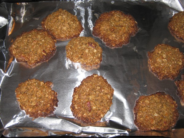 Freshly baked gluten free oatmeal cookies on baking sheet