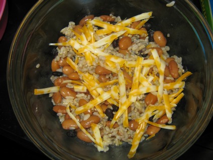 Bowl of black beans pinto beans rice and cheese