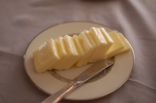 Cut up butter on a plate