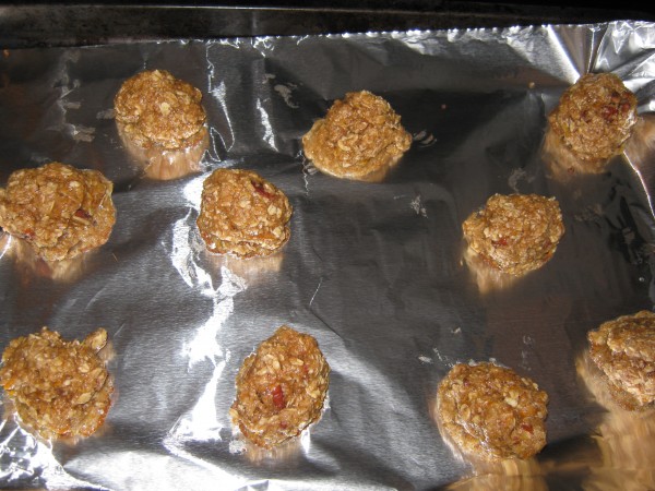 Uncooked oatmeal cookie batter on baking sheet