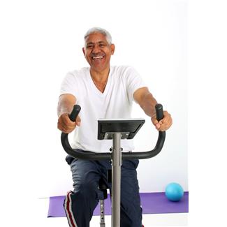 senior citizen riding a stationary bike