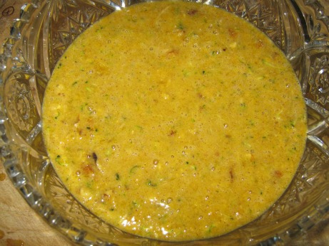 Zucchini bread batter in a glass bowl